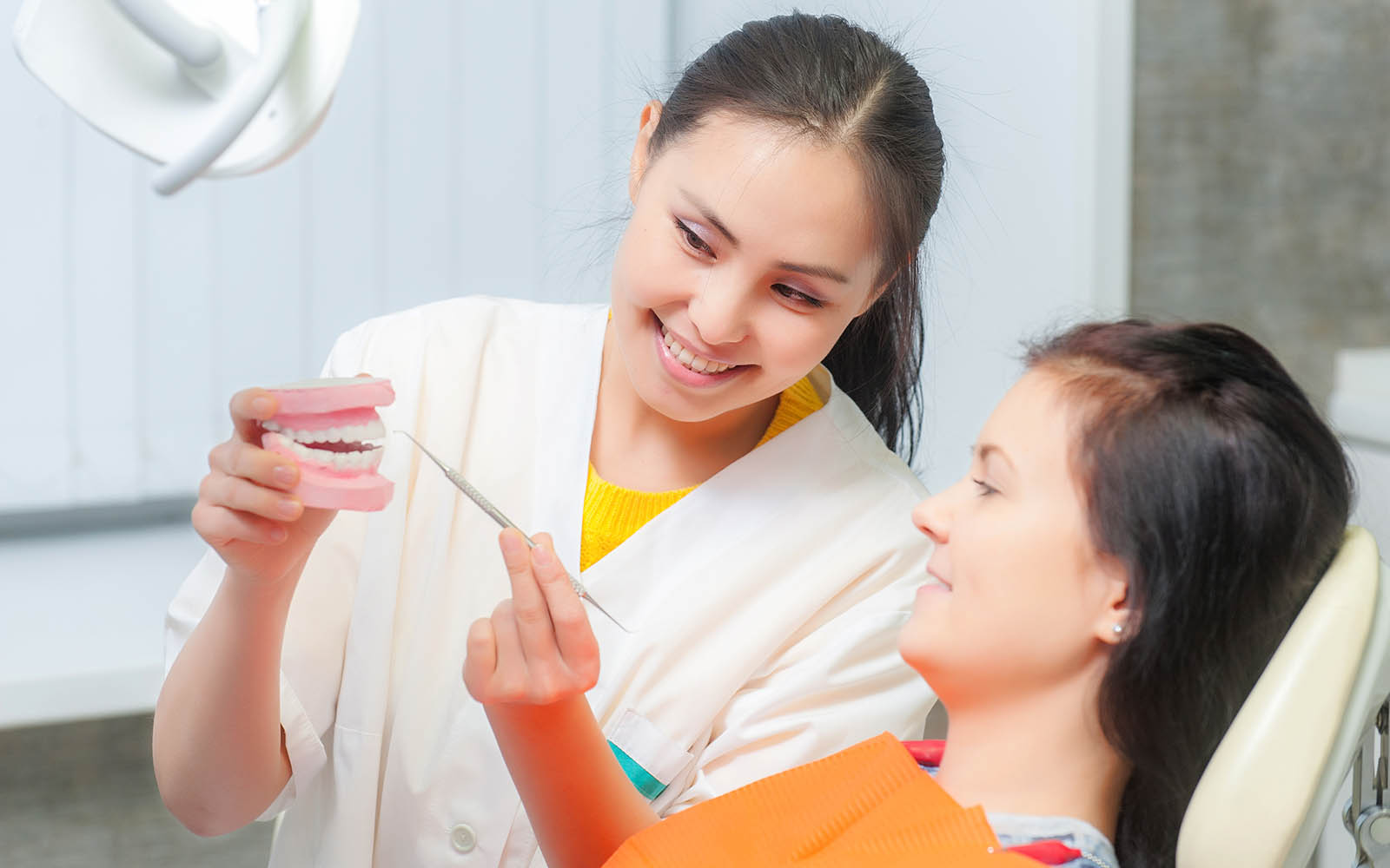 dentist-checking-gum-and-teeth.jpg